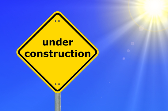this website is under construction shown by yellow road sign